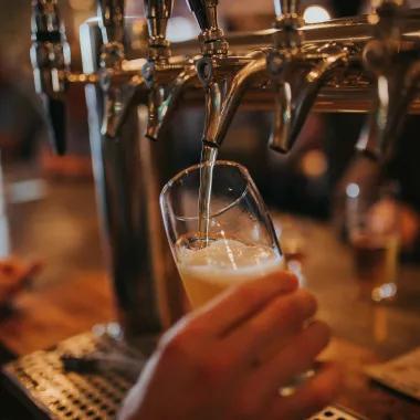 beer tap pouring into glass