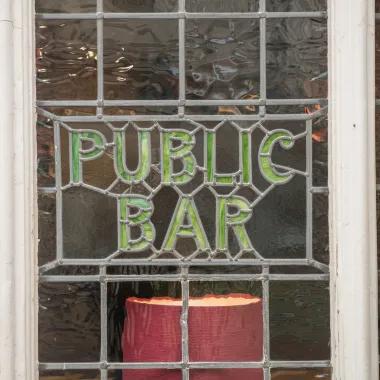 Glass tiles with public bar displayed