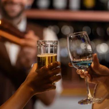 Wine and beer class cheersing at a bar
